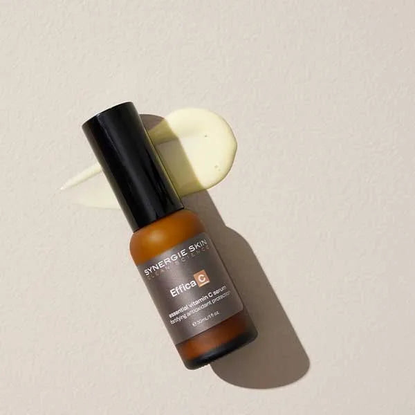 Synergie Skin product, Effica C lying down next to Effica C liquid